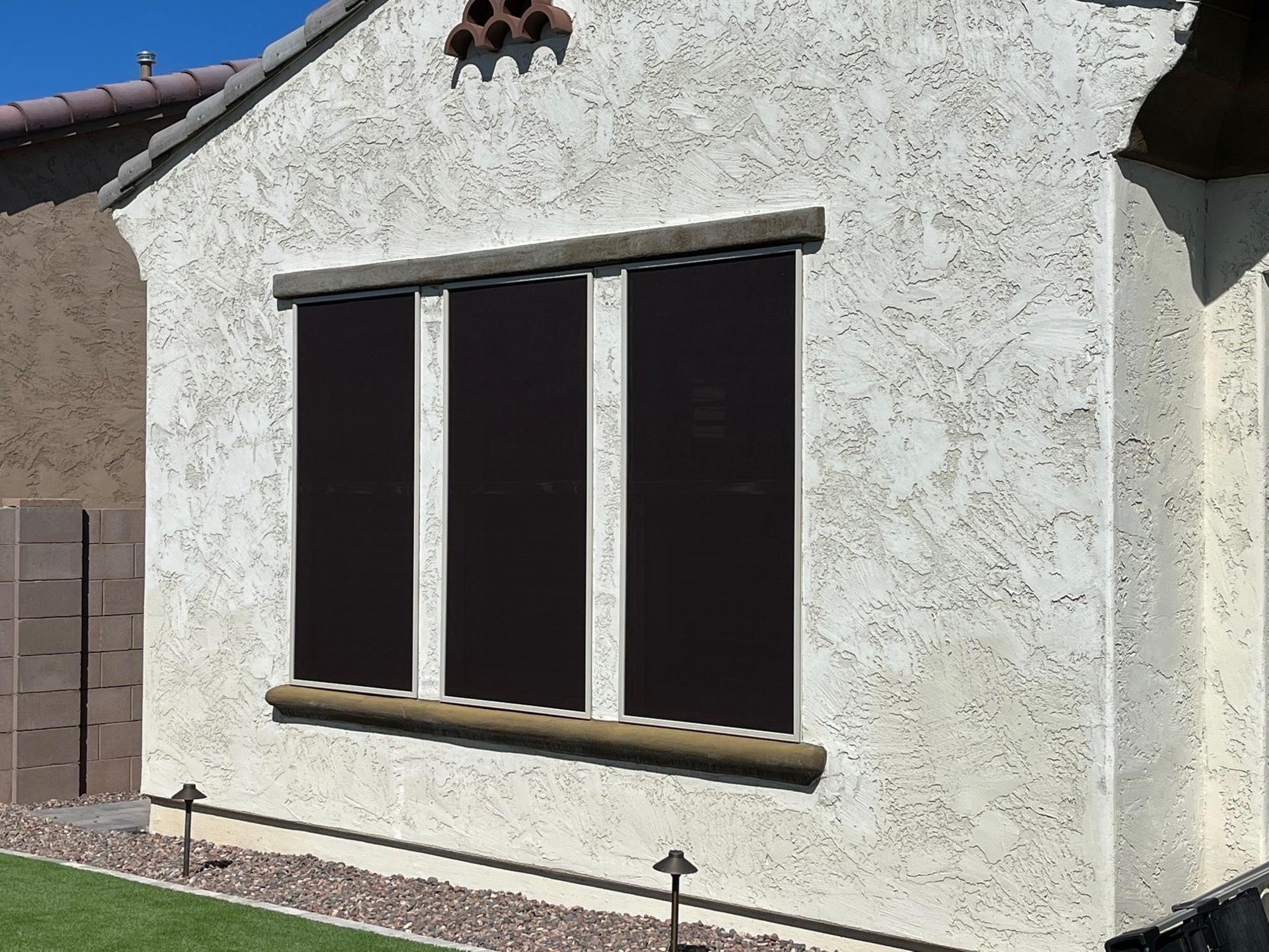 Restored solar screens on three windows of a Tempe home