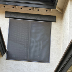 Faded window screen on a Scottsdale home before ScreenRevive cleaning and restoration