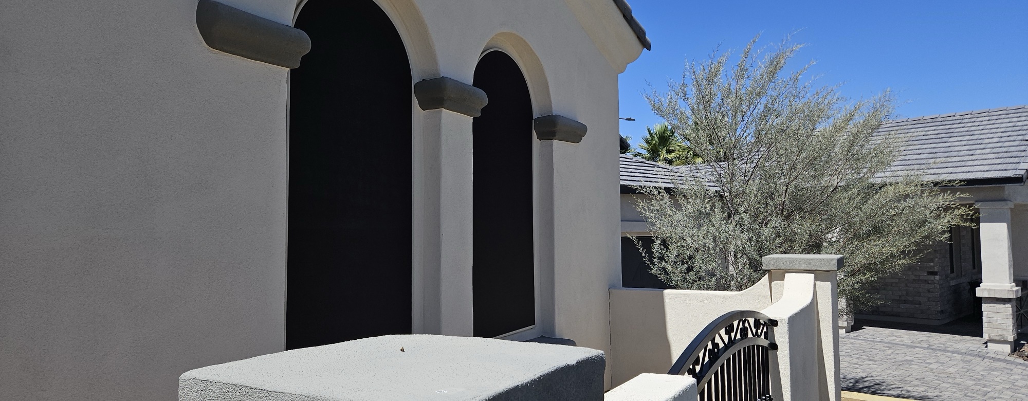 Restored arched window sunscreens on a Gilbert home