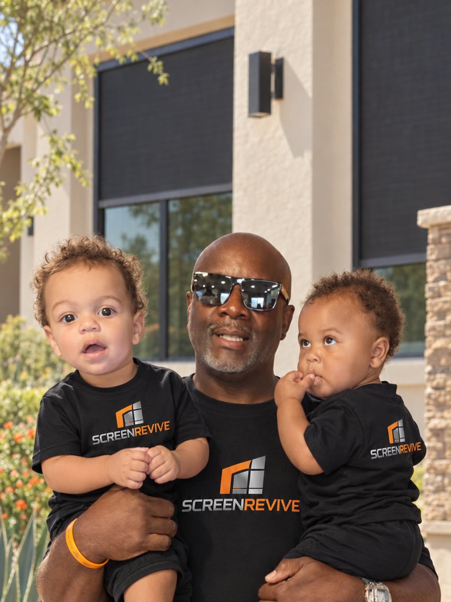 Steve Larkin, owner of ScreenRevive, holding two kids in ScreenRevive shirts outside a Chandler home