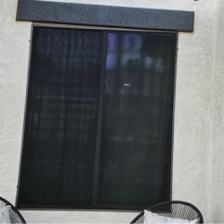 Restored dark window screen on the same Scottsdale home after ScreenRevive cleaning and restoration